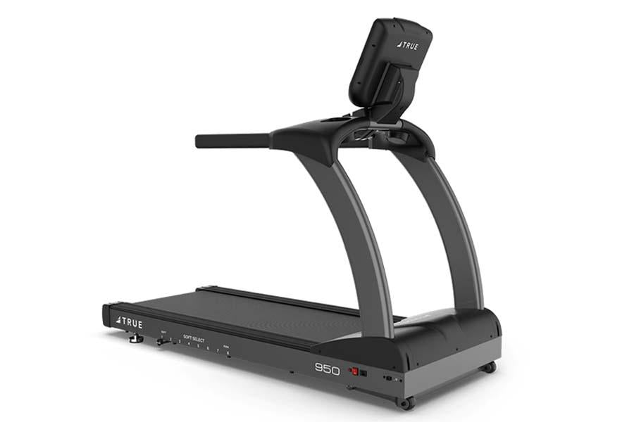 Black and gray True TR950 commercial treadmill with digital display and tablet holder on white background