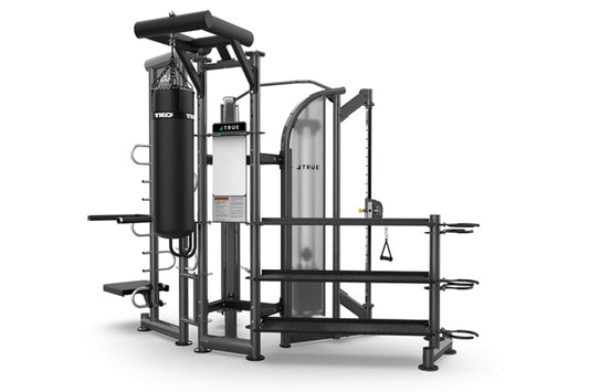 Black and silver multi-station gym equipment with punching bag, leg press, and cable machine on white background