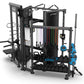 TRUE ATLAS 200 multi-station home gym with black frame, cable machines, resistance bands, blue handles, and dumbbell storage 