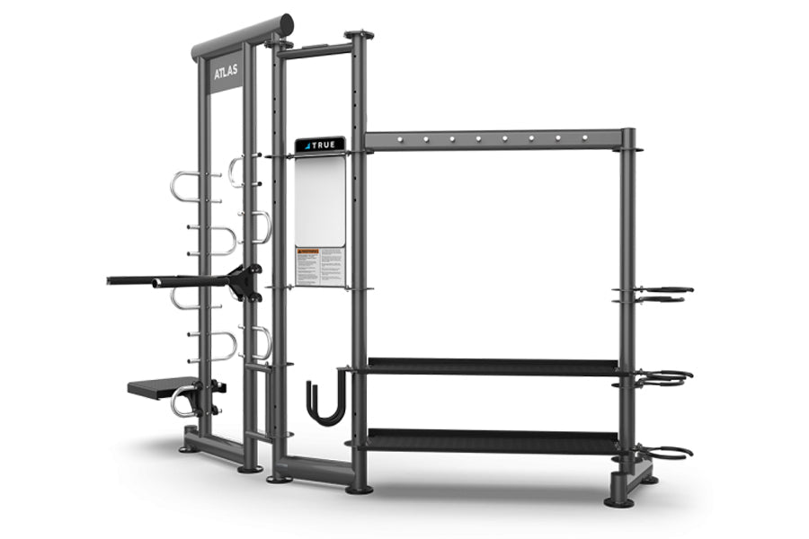 TRUE ATLAS 200 multi-functional gym equipment with grey metal frame, black platforms and bars, cable attachments, and storage