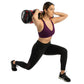 Woman performing weighted lunge exercise while holding burgundy and black Aeromat Extreme Performance Sandbag on shoulder aga