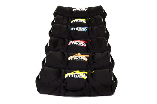 Black training sandbag with multicolored logo designs stacked on white background, front view