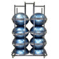 Bosu ball storage rack with eight blue metallic balance balls stacked in two columns, black metal frame with casters on white