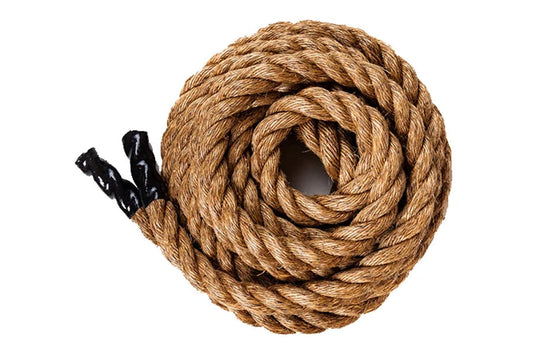 Coiled natural manila rope with black handles on white background, flat lay view