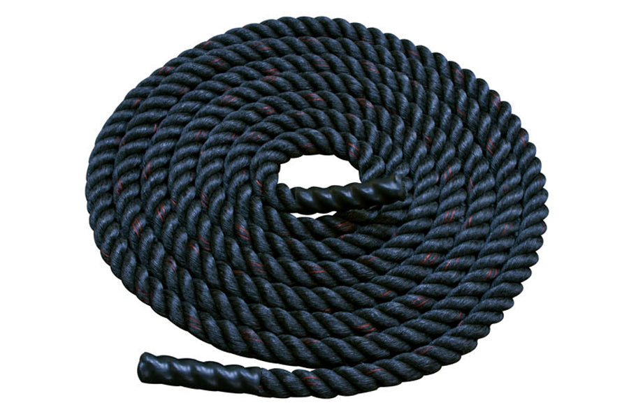 Coiled black twisted battle rope with thick diameter on white background