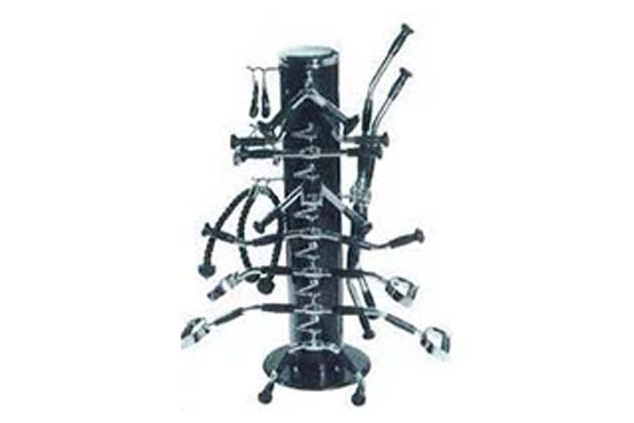 Black metal bar accessories rack with central pole, multiple horizontal arms holding cocktail tools, skis, and bar implements