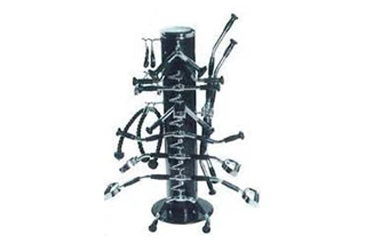 Black metal bar accessories rack with central pole, multiple horizontal arms holding cocktail tools, skis, and bar implements