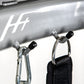 Silver BodyCraft HFT functional trainer with chrome carabiners and black handles attached, detail view of equipment logo and 