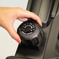 Hand adjusting black tension control dial on BodyCraft VR400 Pro rowing machine
