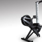 Black and silver BodyCraft VR400 Pro rowing machine with large fan wheel and vertical frame on gray background