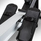 BodyCraft VR400 Pro rowing machine with silver frame and black foot pedals with textured grip straps on white background