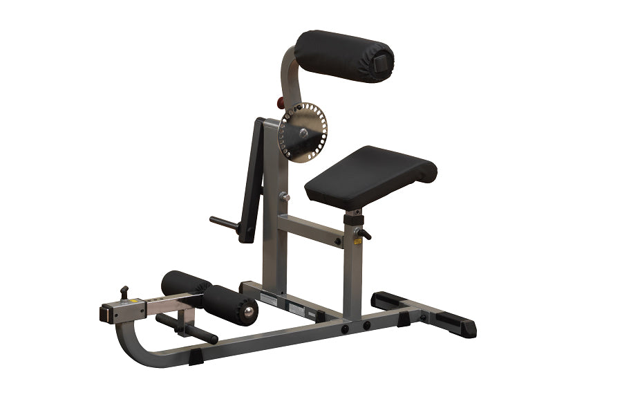 Body-Solid Ab & Back Machine with gray steel frame, black padded seat and back support, adjustable resistance dial, on white 