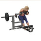 Woman using gray and black leg press ab and back exercise machine with weighted plate on white background