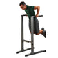 Man performing dip exercise on Body-Solid black steel dip station with horizontal bar, worn on white background