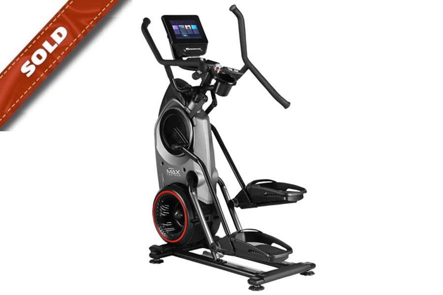 Black and silver Bowflex Max Trainer M9 elliptical with digital display screen and red accent wheel on white background