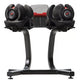 Pair of black adjustable dumbbells with red accents on gray and red weight selector stand, on white background