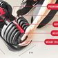 Bowflex SelectTech adjustable dumbbells with red hand grips held by person, black weights with silver stripes on base, shown 