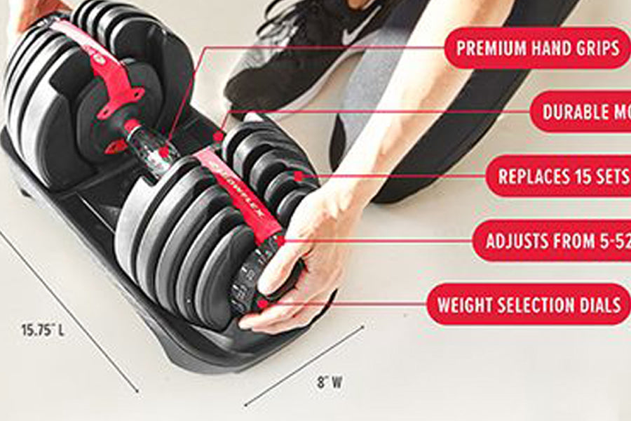 Bowflex SelectTech adjustable dumbbells with red hand grips held by person, black weights with silver stripes on base, shown 
