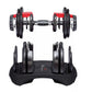 Pair of adjustable red and black dumbbells with weight selector dials on stand, flat lay view
