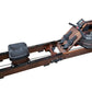 Brown and black folding water rowing machine with footrest, digital monitor, and water tank on white background