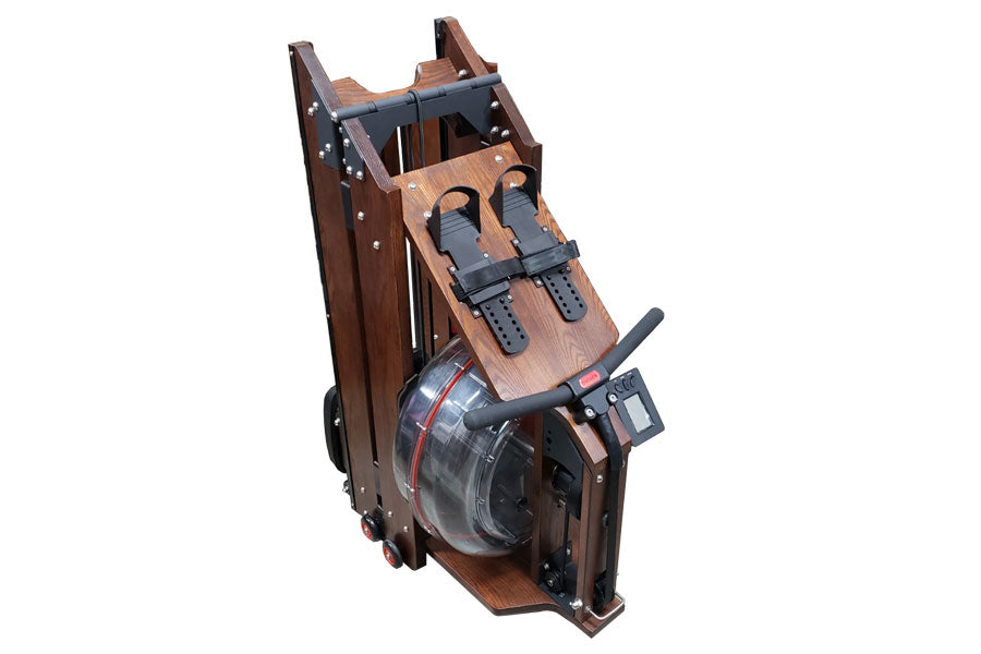 Folding water rowing machine with brown wood frame, black footrest straps, and transparent water resistance chamber on white 