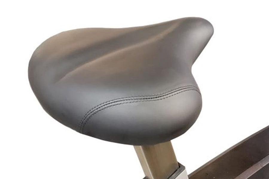 Gray padded seat with stitching detail on California Fitness UB30 upright exercise bike