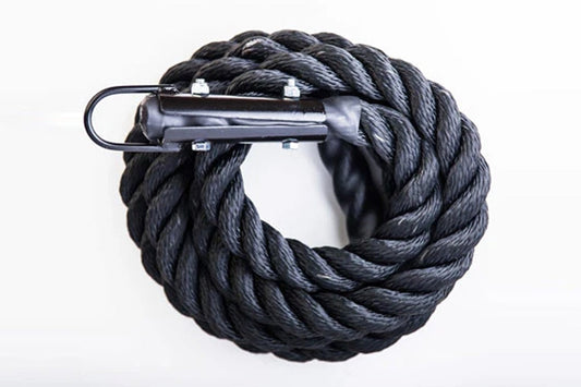Black twisted climbing rope coiled with metal carabiner attachment on white background