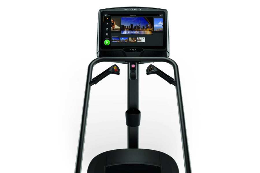 Matrix C50 Climbmill with digital touchscreen display showing workout content and controls, black frame with dual handles on 
