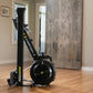 Concept2 RowErg black indoor rowing machine with tall vertical rail and circular resistance fan, displayed in home setting on