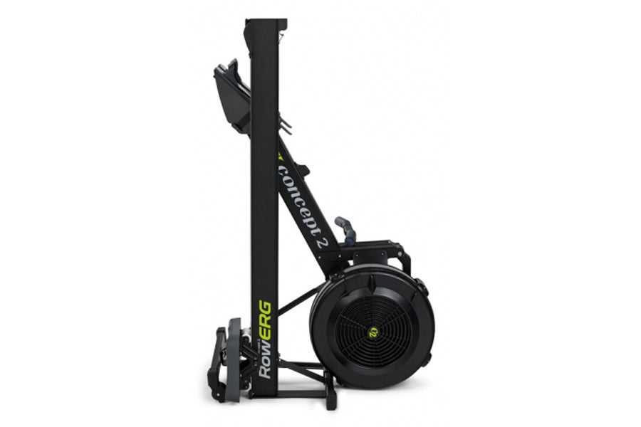 Concept2 RowErg indoor rowing machine with black frame, tall vertical rail, and round black flywheel with yellow center logo 