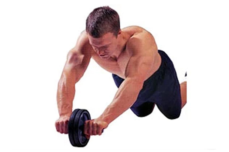 Man performing dumbbell exercise wearing black shorts, demonstrating core workout on white background