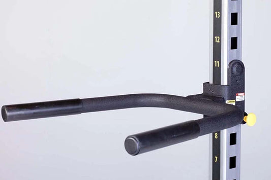 Black powder-coated dip handles attachment with foam grips, mounted on numbered weight rack upright on white background
