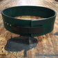 Green leather weightlifting belt with black lever buckle and Pioneer branding on wood surface