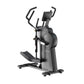 Black and gray upright elliptical trainer with digital display, dual handles, and foot pedals on white background