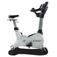 TRUE ES900 upright exercise bike with white and gray frame, black seat and handlebars, digital display, shown on white backgr