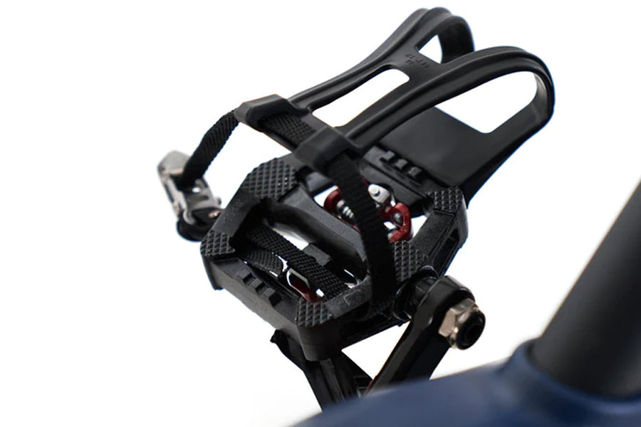 Black pedals with textured platform and toe cage straps on Echelon GT+ Connect stationary bike