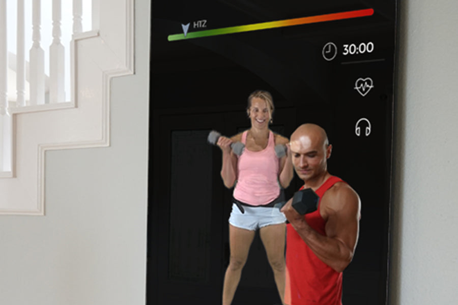 Echelon Reflect 40 smart fitness mirror displaying workout interface with two people exercising with dumbbells on black scree