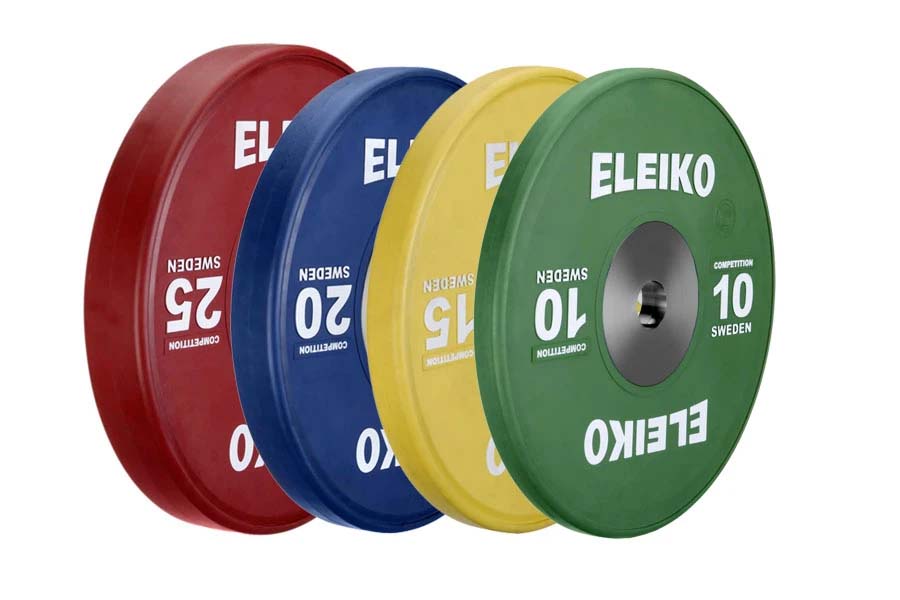 Set of four Eleiko IWF training bumper plates in red, blue, yellow, and green with white text on white background