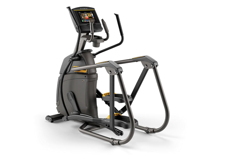 Black and gray elliptical fitness machine with digital display console and yellow accent details, viewed from the side on whi