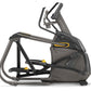 Black and gray elliptical trainer with yellow accents, adjustable handlebars, and pedals, on white background