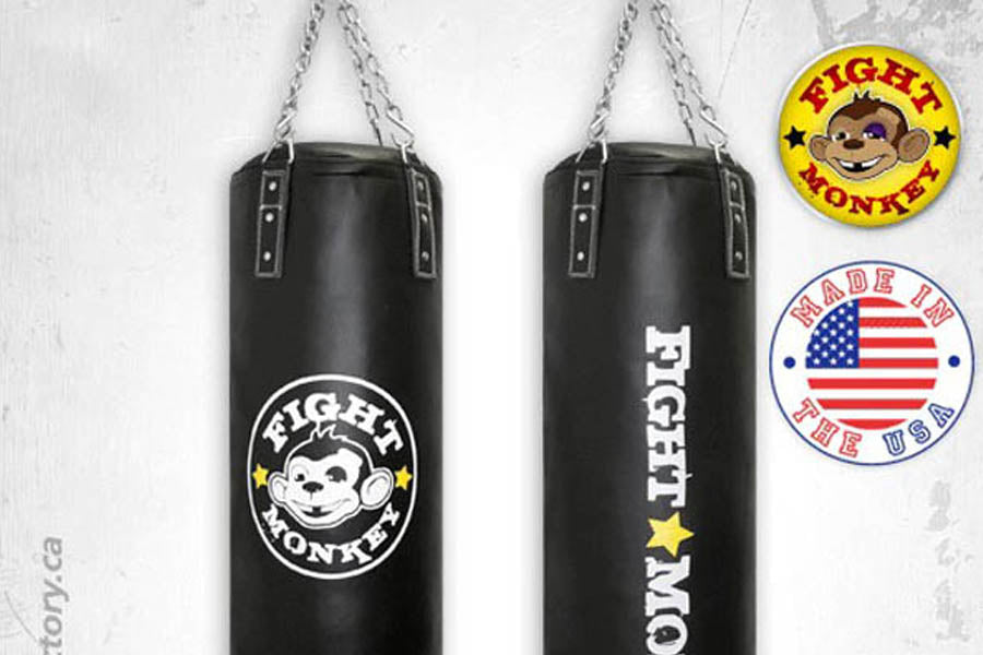 Black cylindrical heavy punching bag with silver chain hanging straps, white Fight Monkey logo and text, shown front and side