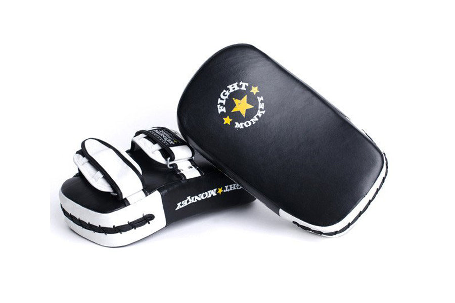 Black and white leather Muay Thai focus pads with gold star logo, shown with black protective carrying case on white backgrou