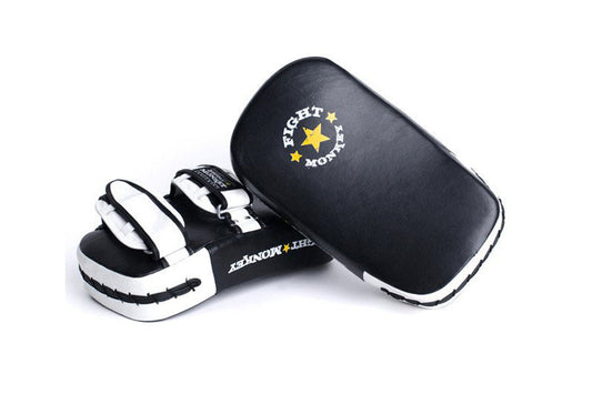 Black and white leather Muay Thai focus pads with gold star logo, shown with black protective carrying case on white backgrou