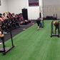 Warrior Firm Turf artificial grass flooring in indoor fitness gym with athletes training