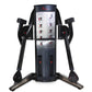 Black dual cable crossover machine with exercise instruction chart, adjustable arms, and red accent buttons on white backgrou