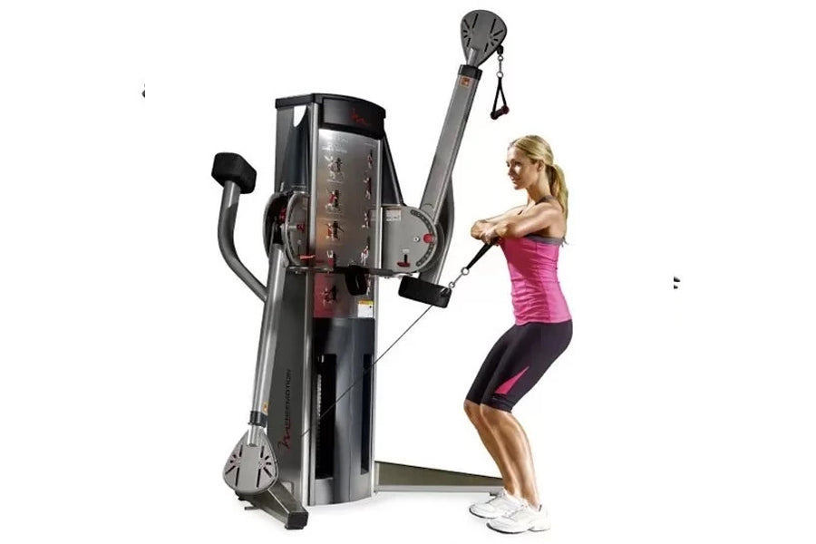 Freemotion Genesis G624 dual cable cross machine with woman demonstrating chest fly exercise in pink tank top and black leggi
