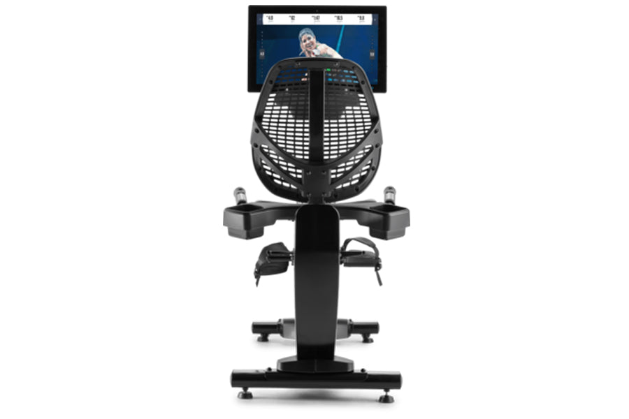 Black recumbent exercise bike with tablet holder displaying fitness content, viewed from front on white background