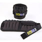 GoFit adjustable ankle weights in black neoprene with padded pockets and yellow brand labels, shown as wrist and ankle set on