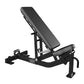 Black adjustable weight bench with padded back and seat, angled leg extension attachment, on white background