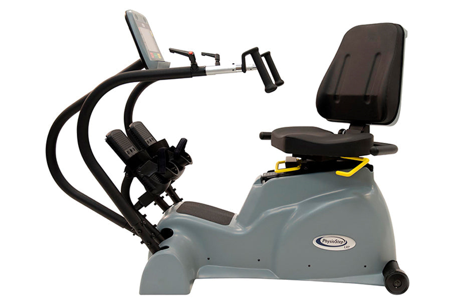 Gray and black recumbent elliptical exercise machine with digital display, pedals, and padded seat on white background